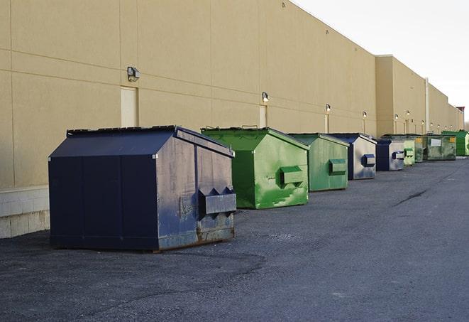 an assortment of sturdy and reliable waste containers near a construction area in Canton